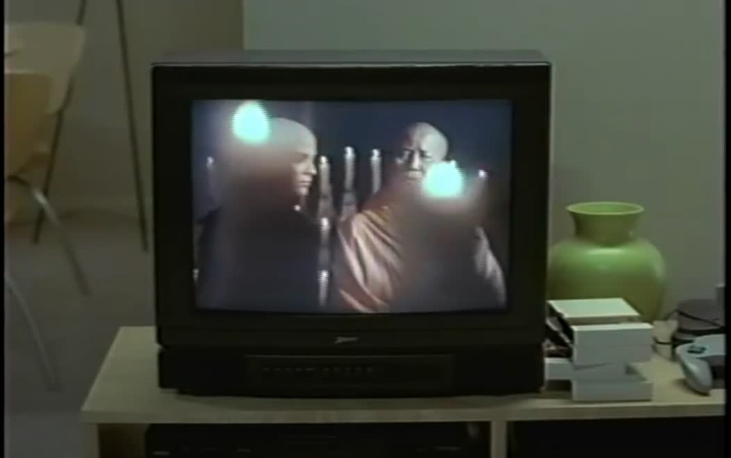 Image of an N64 on the right side of the screen in the movie Office Space. Standard aspect ratio